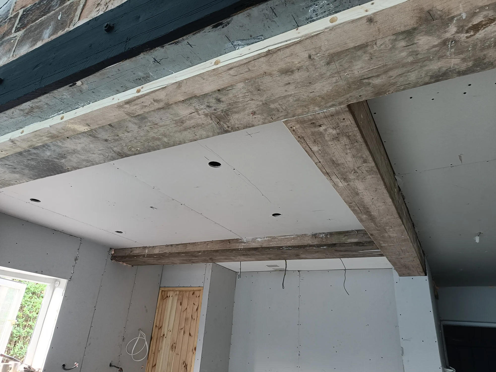 Wrapped beam meeting the wall